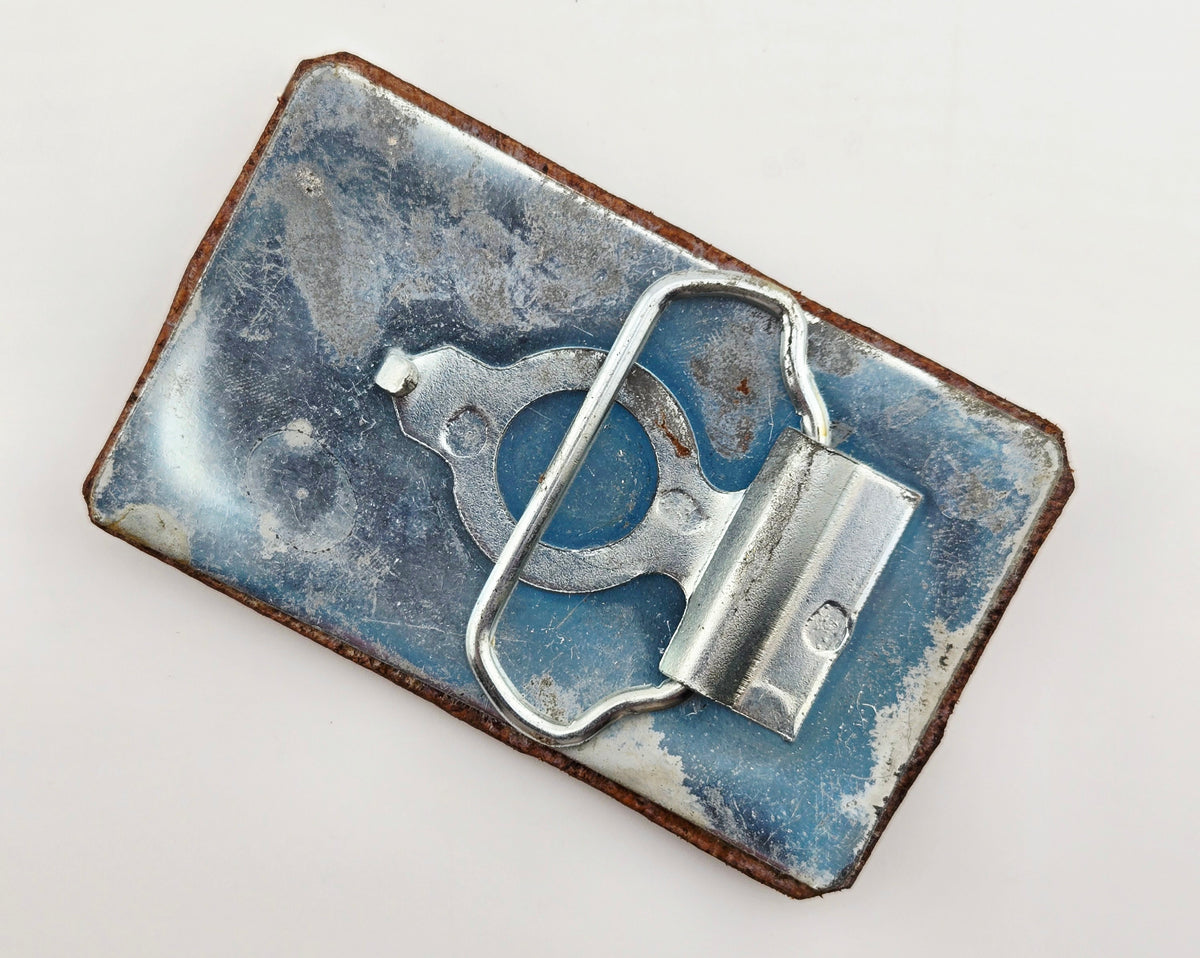 Back of the Hand Tooled Leather Vintage Belt Buckle — Geometric Tribal Spirals, showing the silver-tone metal belt buckle back and loop hardware.