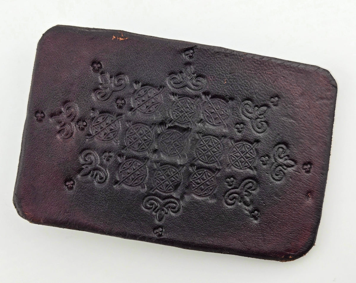 Front of the Hand Tooled Leather Vintage Belt Buckle — Dark Lattice Medallions, showing a dark brown face tooled with a diamond lattice of crosshatched medallions and scroll flourishes.