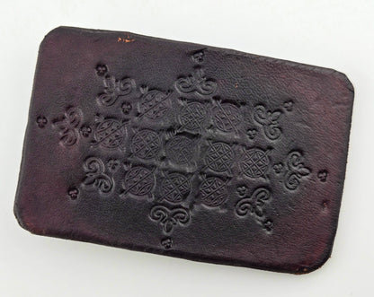 Front of the Hand Tooled Leather Vintage Belt Buckle — Dark Lattice Medallions, showing a dark brown face tooled with a diamond lattice of crosshatched medallions and scroll flourishes.